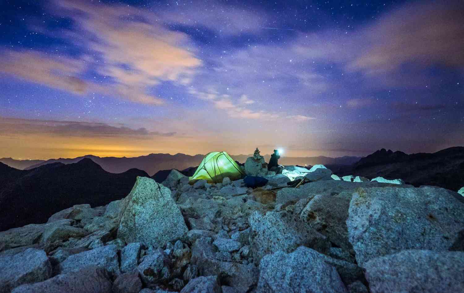 People in camp at night